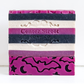 Mellow Monkey Witching Hour artisan soap bar with purple, black, and white stripes and bat and moon cutouts.