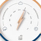 Mellow Monkey navy blue and white wood barometer with beech frame, lightning bolt pointer, and mineral glass face. Forecasts weather.