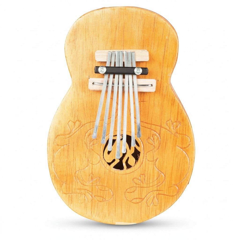 Mellow Monkey wooden thumb piano with 7 metal tines and carved floral details. 10.5-inch kalimba.