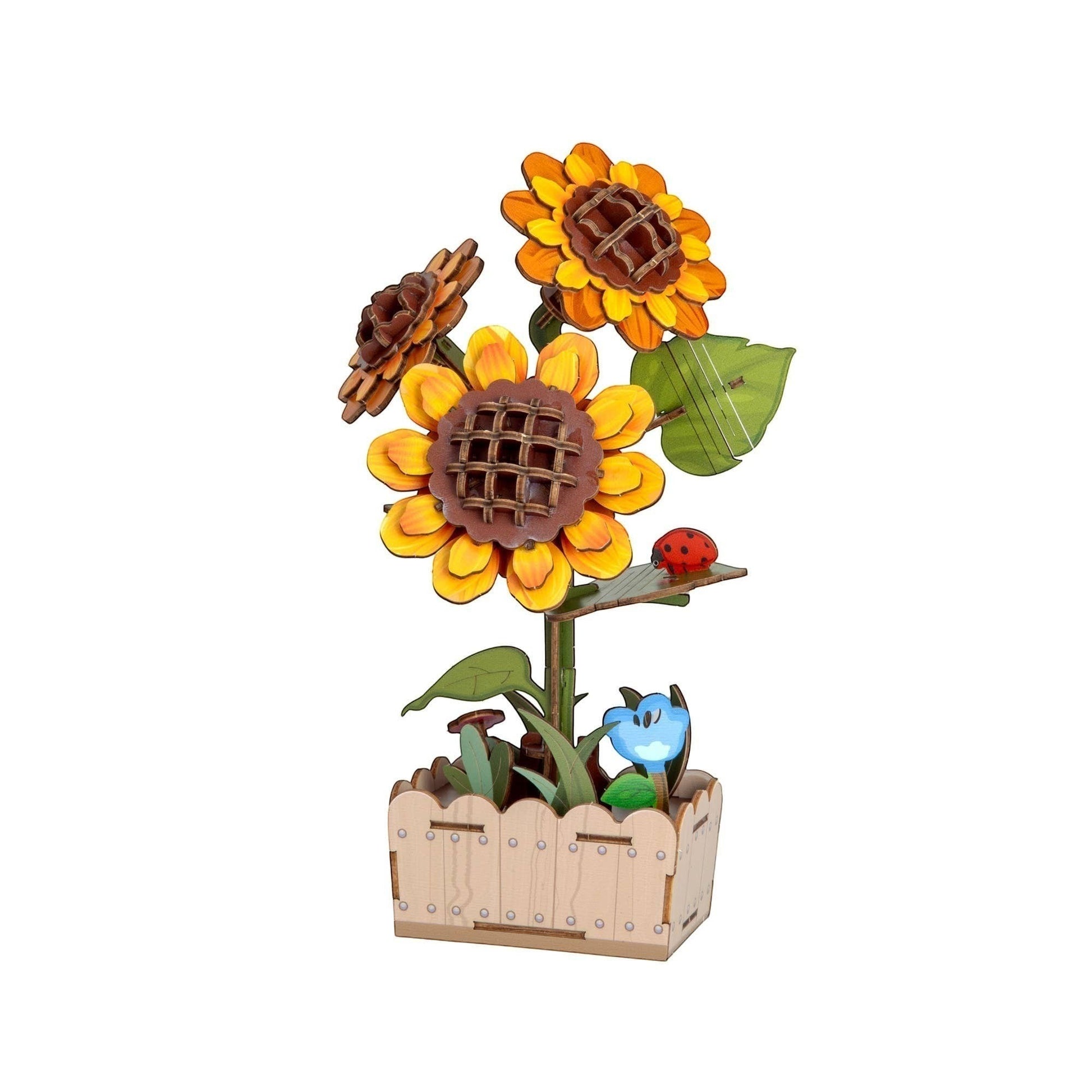 Mellow Monkey DIY wooden sunflower puzzle kit with three blooming sunflowers in a wooden planter, featuring a ladybug accent.