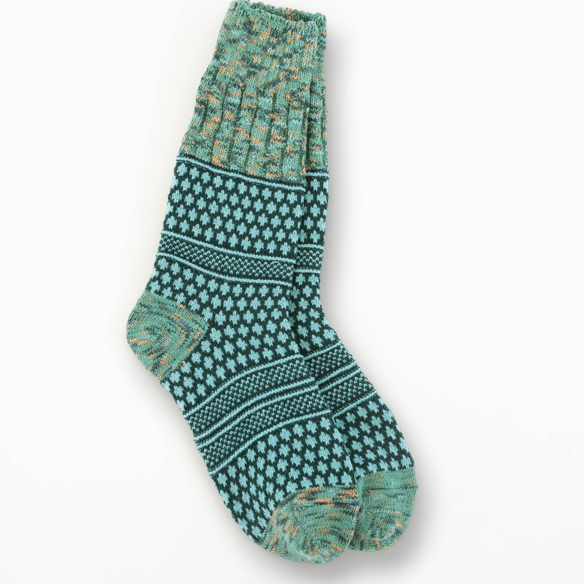 Mellow Monkey Woodland crew socks featuring a teal and green textured geometric pattern with a soft knit finish.