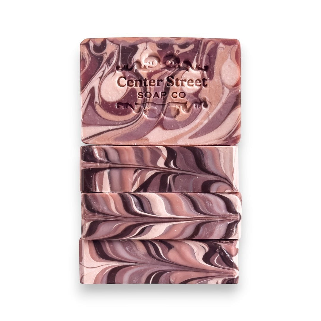 Mellow Monkey Woods vegan handmade bar soap with mahogany, cedarwood, and oakwood notes. Swirled brown and pink.