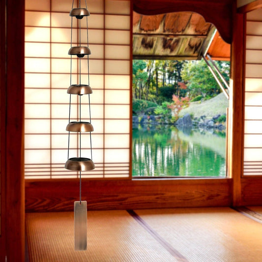 Mellow Monkey Woodstock Temple Bells Quintet in copper hanging in a zen-inspired room with shoji screens and garden view
