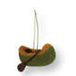 Mellow Monkey handcrafted wool felt canoe ornament in green and orange with a small brown paddle