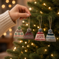 Mellow Monkey handmade wool felt hat ornaments with intricate embroidery hanging on a festive Christmas tree