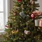 Mellow Monkey handcrafted wool felt outdoor themed ornaments hanging on a decorated Christmas tree