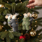 Mellow Monkey wool felt piggyback mice ornaments in winter overalls hanging on a Christmas tree branch
