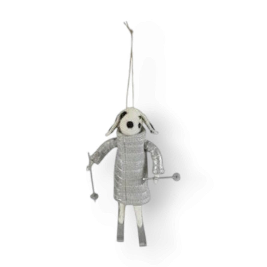 Mellow Monkey handcrafted wool felt dog ornament wearing a silver quilted coat and holding miniature ski poles