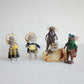 Mellow Monkey handcrafted wool felt mouse ornaments dressed as tourists with plaid outfits and travel accessories.