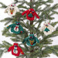 Mellow Monkey hand-crafted wool sweater ornaments with festive holiday designs hanging on a Christmas tree