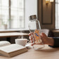 Mellow Monkey vinyl sticker featuring a cat wearing a sash that says World's Best Overthinker on a glass water bottle.