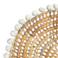 Mellow Monkey woven round placemat with clam rose edge, 13-inch diameter, natural straw material with intricate spiral design.