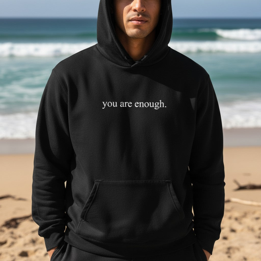 Mellow Monkey black unisex hoodie with "you are enough." printed on the front. Soft and durable.