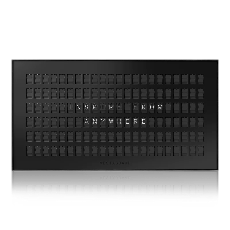 Vestaboard example display. white split flap letters on black background reads, "inspire from anywhere"