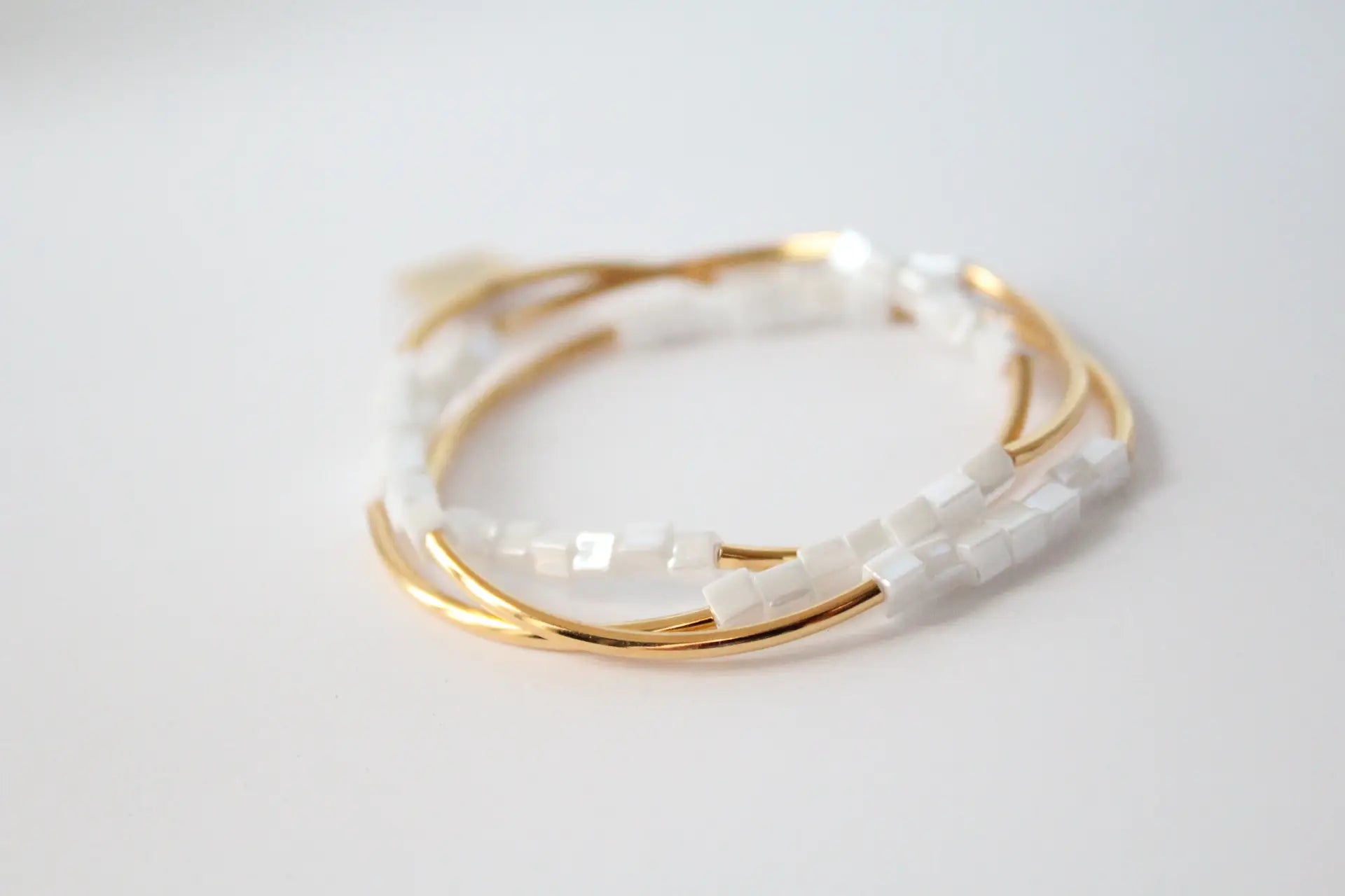 Gold and White Square Triple Wrap Bracelet.